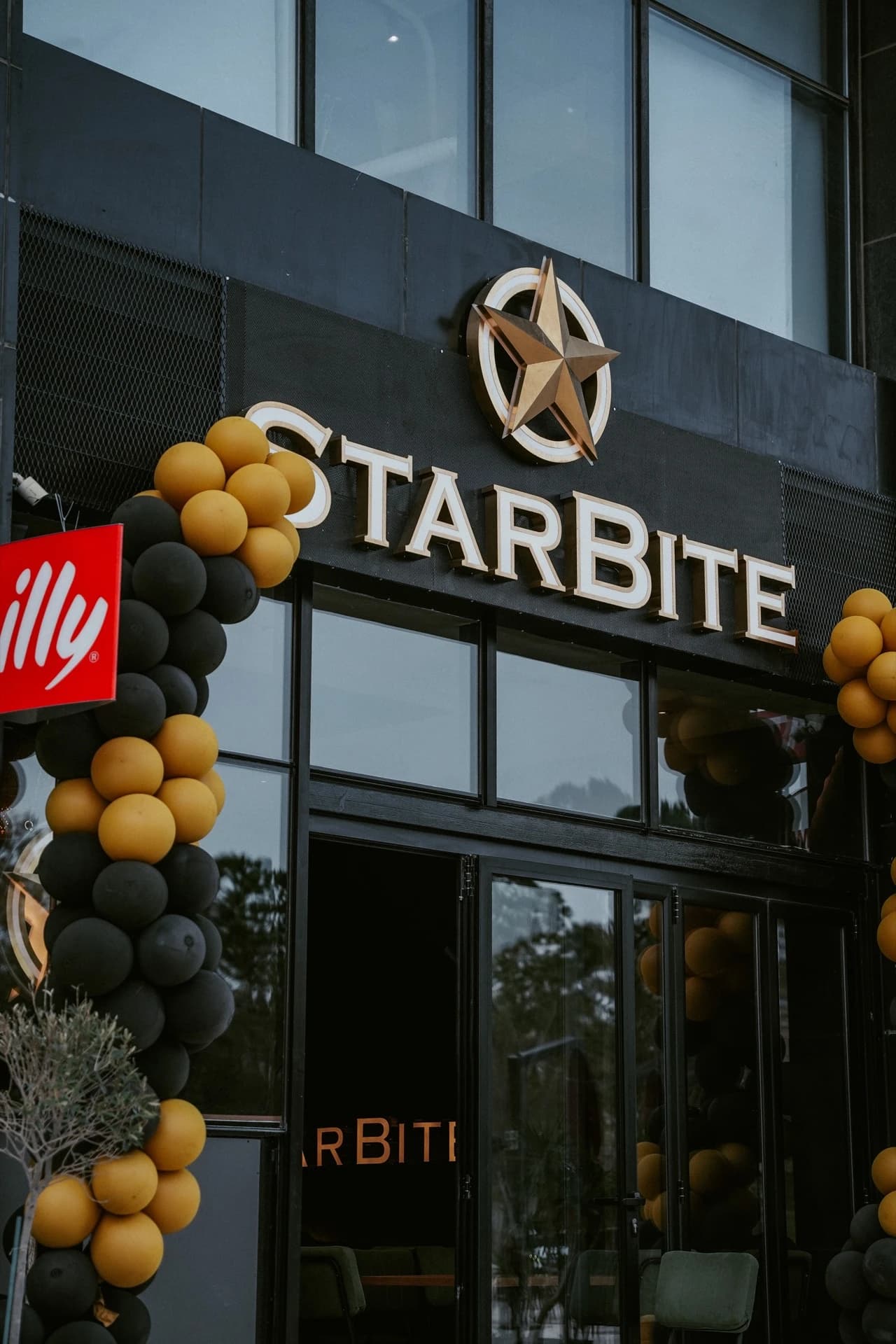 Starbite storefront with balloon arch
